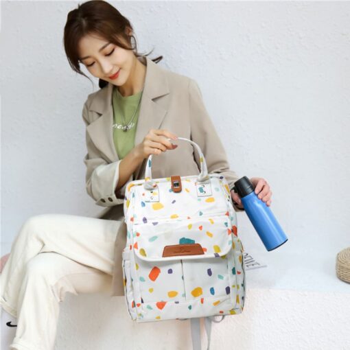 mom and baby travel bag with multiple compartments